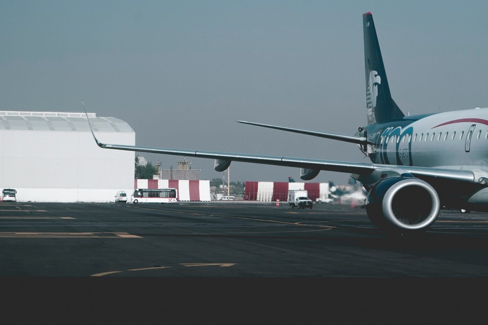 white and blue airliner on airport